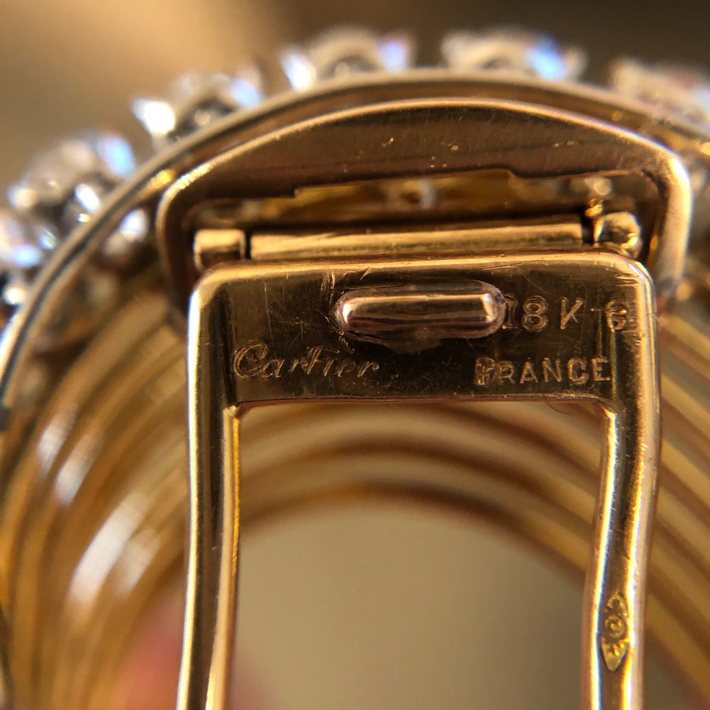 
                      
                        Macklowe Gallery Cartier Gold and Diamond Swirl Brooch
                      
                    