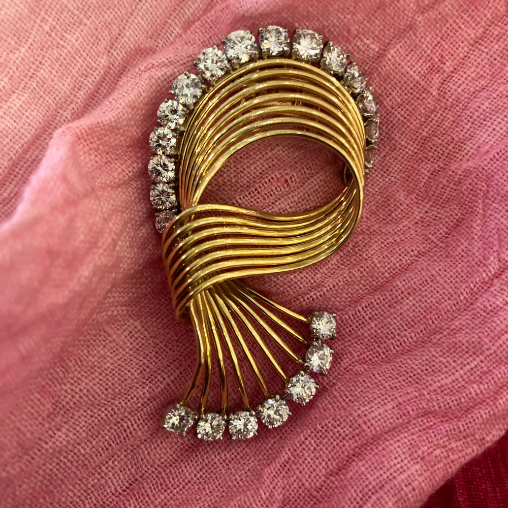 
                      
                        Macklowe Gallery Cartier Gold and Diamond Swirl Brooch
                      
                    
